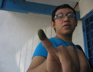 purple-finger Tiara proudly brandishes a once-purple, now inexplicably green, finger.